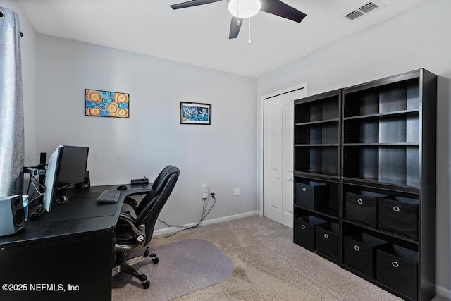 carpeted home office with ceiling fan