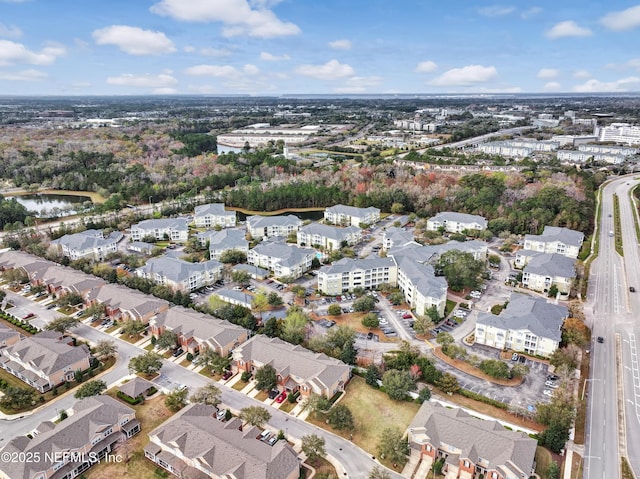 bird's eye view featuring a residential view and a water view