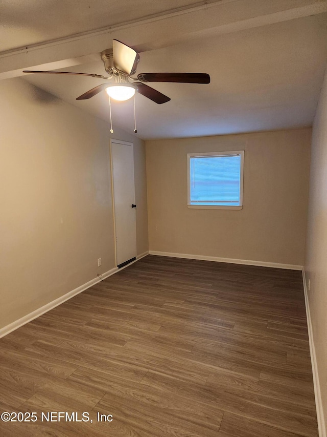 unfurnished room with a ceiling fan, baseboards, and wood finished floors