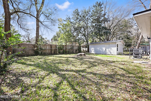 view of yard with a fenced backyard and an outdoor structure