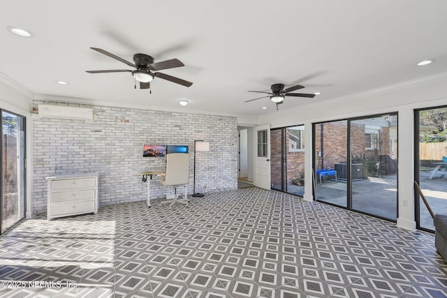 unfurnished sunroom featuring a ceiling fan and a wall unit AC