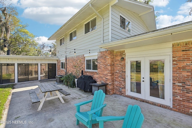 view of patio / terrace featuring french doors and grilling area