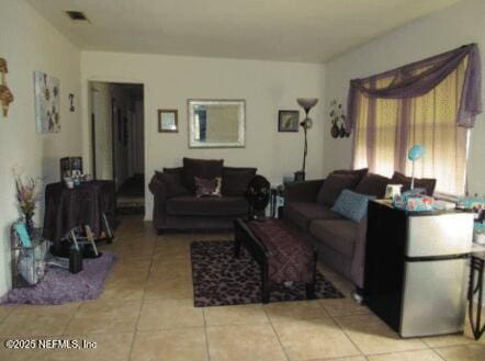 tiled living area with visible vents