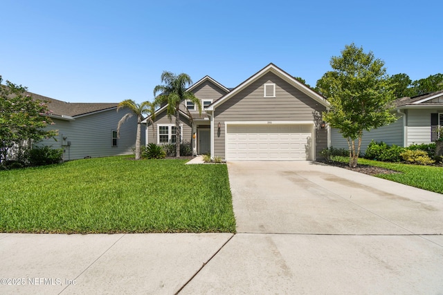 view of front of property featuring a garage and a front lawn