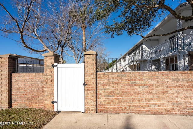 view of gate featuring fence