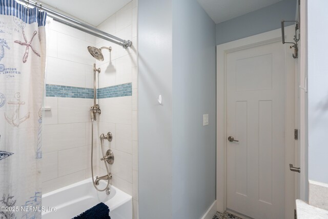 full bathroom featuring shower / bath combo with shower curtain