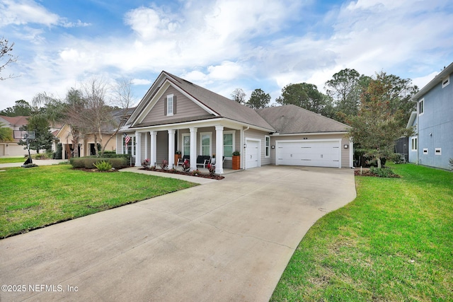 view of front of house featuring a garage, covered porch, driveway, and a front lawn