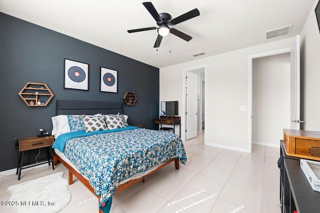 bedroom with visible vents, baseboards, and light tile patterned flooring