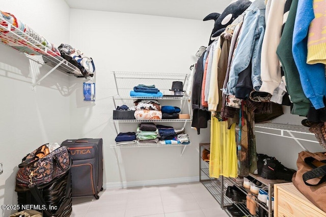 spacious closet with tile patterned flooring