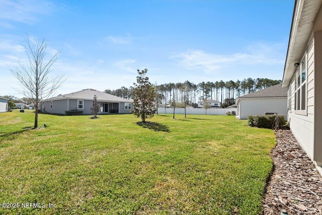 view of yard featuring fence