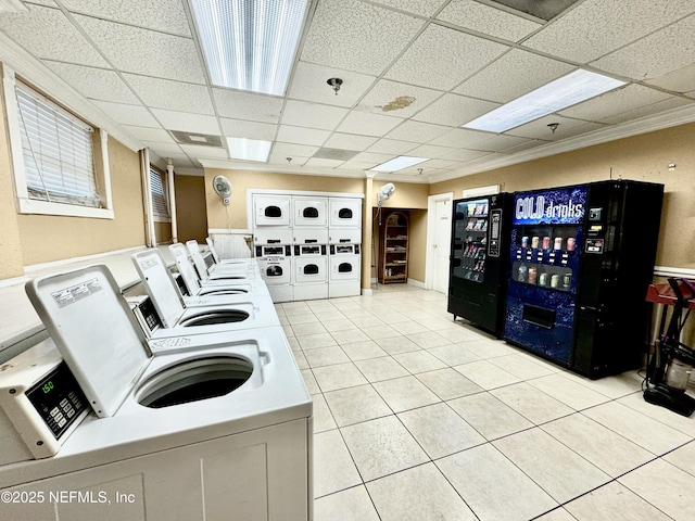 washroom featuring stacked washing maching and dryer, light tile patterned floors, and separate washer and dryer