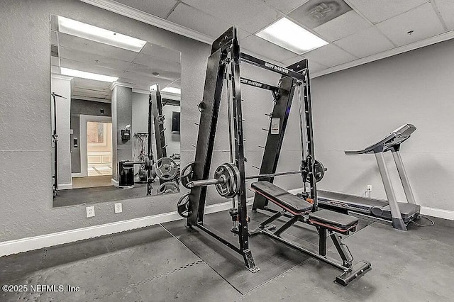 exercise area featuring a paneled ceiling