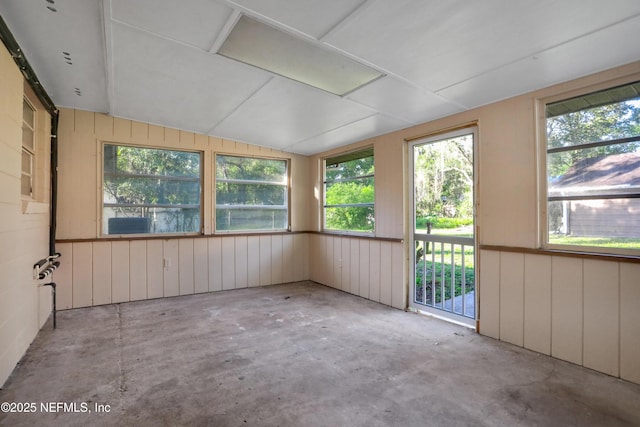 unfurnished sunroom featuring lofted ceiling