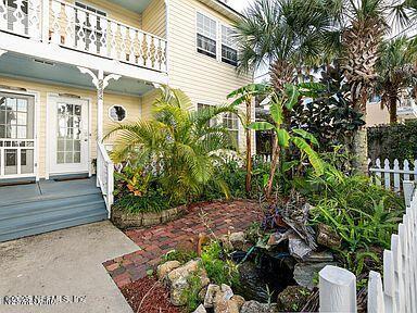 view of yard featuring a balcony and fence