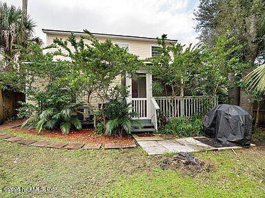 exterior space featuring fence and a front yard