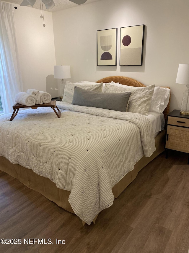 bedroom featuring wood finished floors