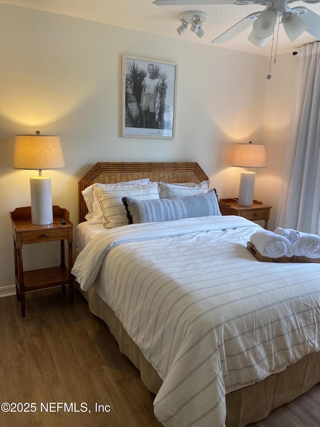 bedroom with wood finished floors