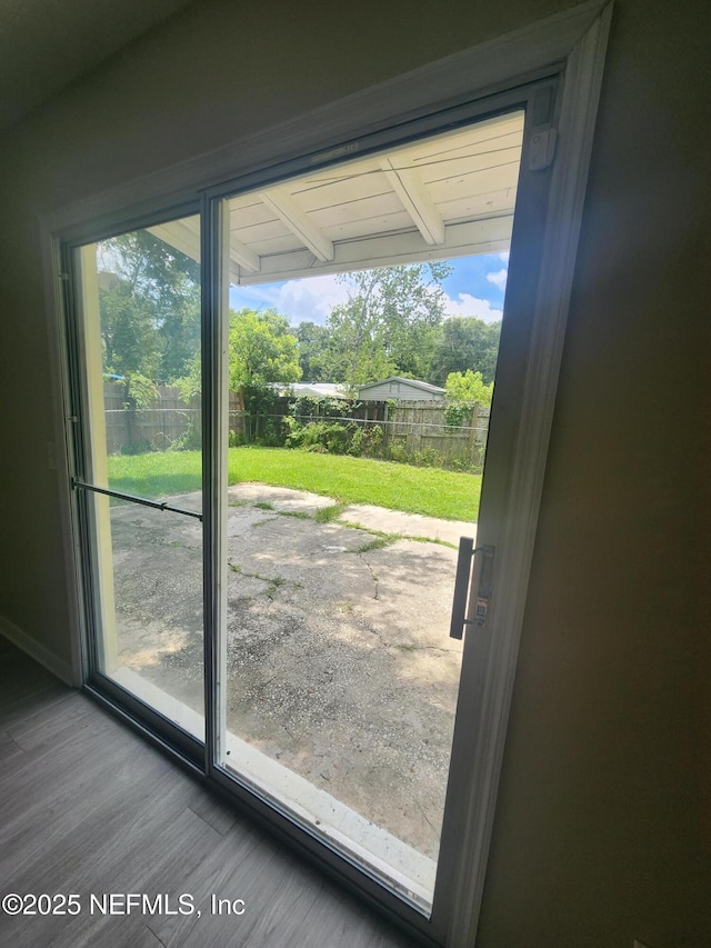 doorway to outside with wood finished floors