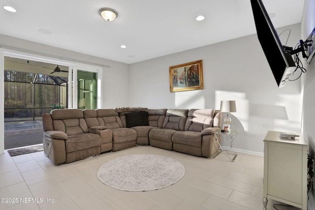 living area with recessed lighting, ceiling fan, and baseboards