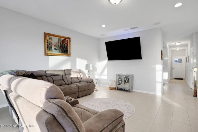 living room featuring light tile patterned flooring, visible vents, baseboards, and recessed lighting