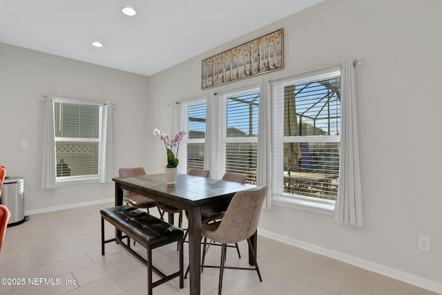 dining area featuring baseboards and recessed lighting