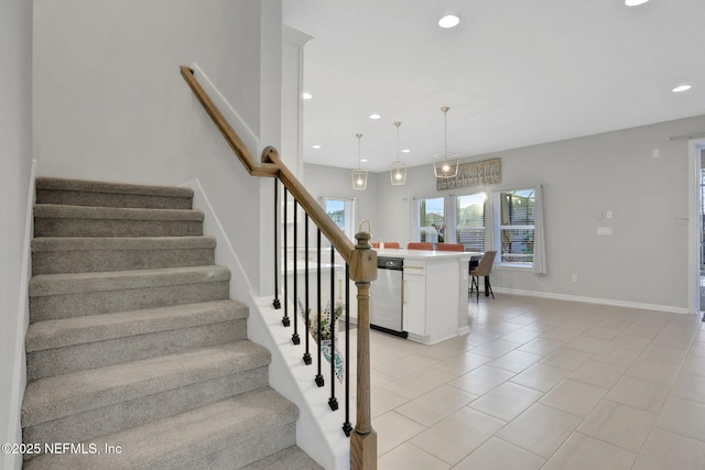 stairway with tile patterned floors, baseboards, and recessed lighting