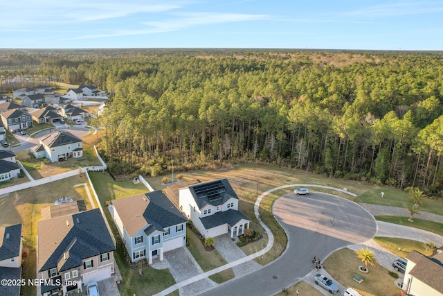 aerial view with a residential view and a view of trees