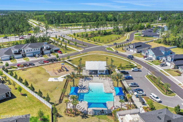 drone / aerial view with a view of trees