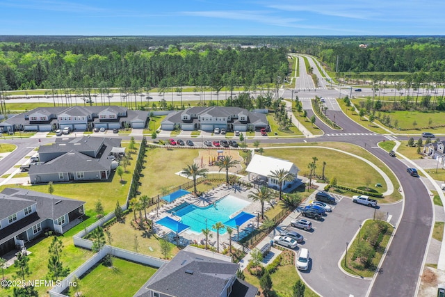 bird's eye view with a residential view and a view of trees