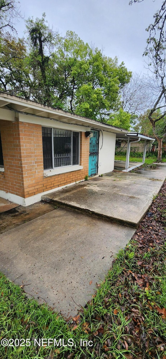 view of home's exterior featuring brick siding