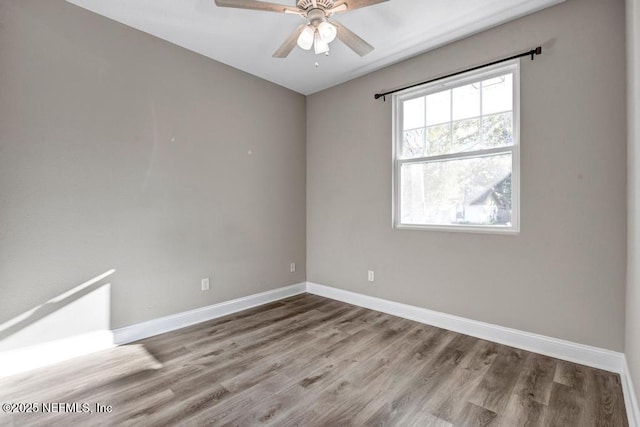 spare room featuring ceiling fan and wood-type flooring