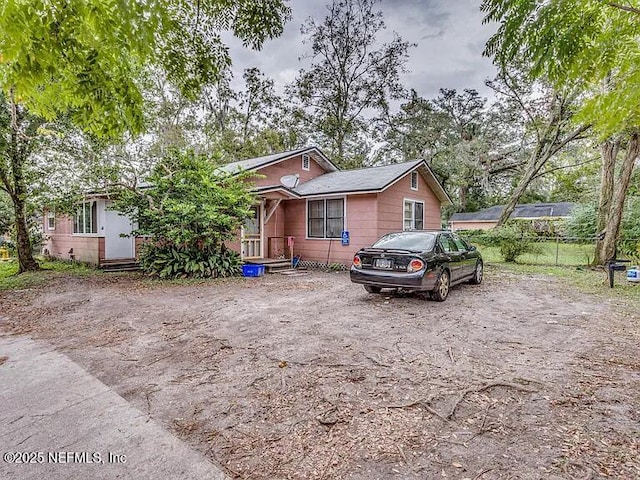 view of front of home with fence