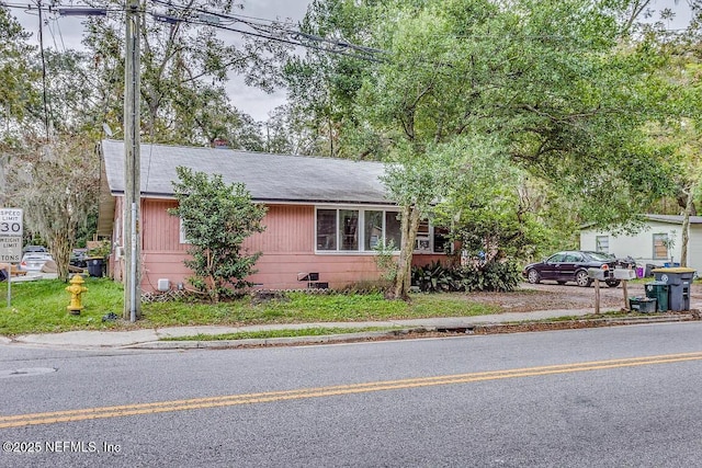 view of front of property featuring crawl space and roof with shingles