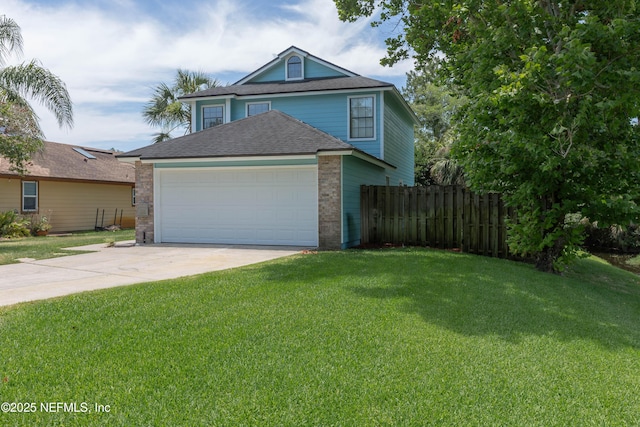 traditional home featuring a front lawn, an attached garage, fence, and driveway