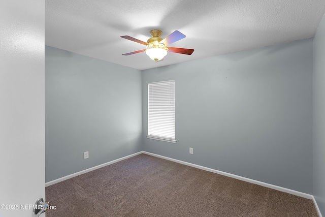 carpeted empty room with a textured ceiling, baseboards, and ceiling fan