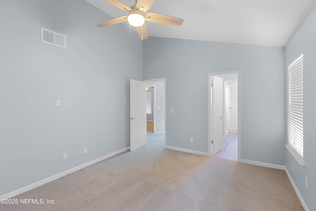 unfurnished room featuring visible vents, light colored carpet, baseboards, and ceiling fan