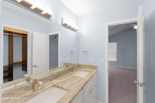 bathroom featuring a sink, visible vents, and double vanity