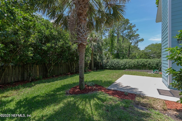 view of yard with a patio and fence