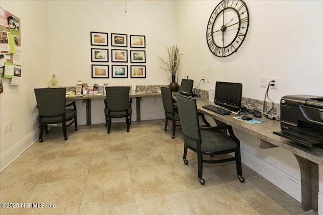 office space with built in desk and light tile patterned floors