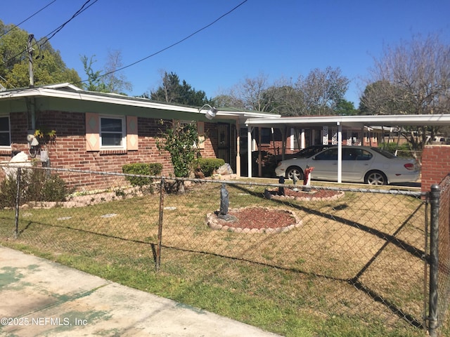 ranch-style house with a front yard, brick siding, and fence