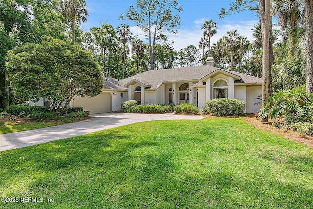 ranch-style home with an attached garage, stucco siding, concrete driveway, and a front yard