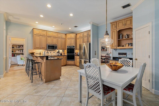 kitchen with stainless steel appliances, ornamental molding, a breakfast bar area, recessed lighting, and decorative backsplash