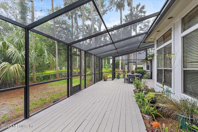 unfurnished sunroom featuring lofted ceiling