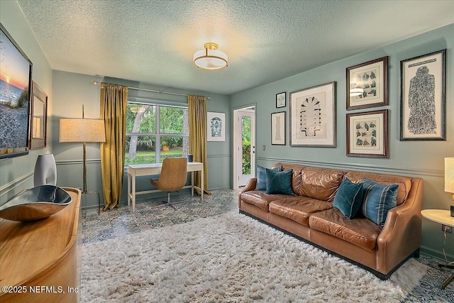 office area featuring a textured ceiling and baseboards