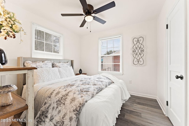 bedroom with dark wood-type flooring, baseboards, and a ceiling fan