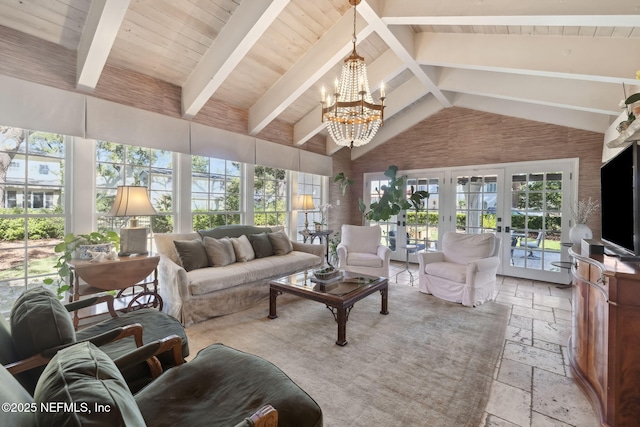 sunroom featuring french doors, vaulted ceiling with beams, an inviting chandelier, and wood ceiling