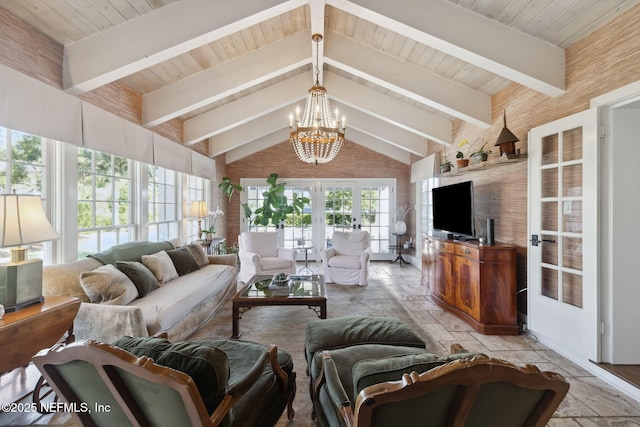 living room featuring french doors, wooden ceiling, a notable chandelier, and beam ceiling