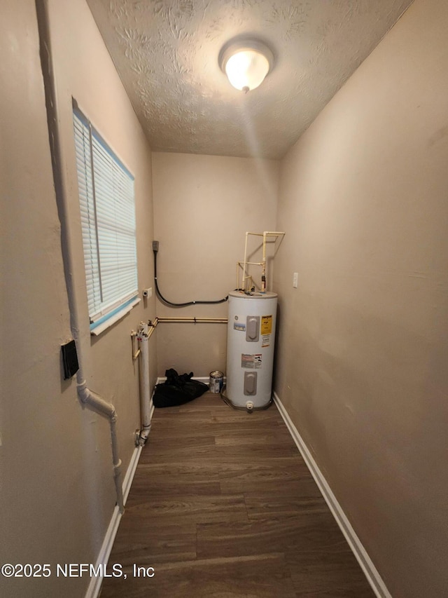 utility room featuring electric water heater