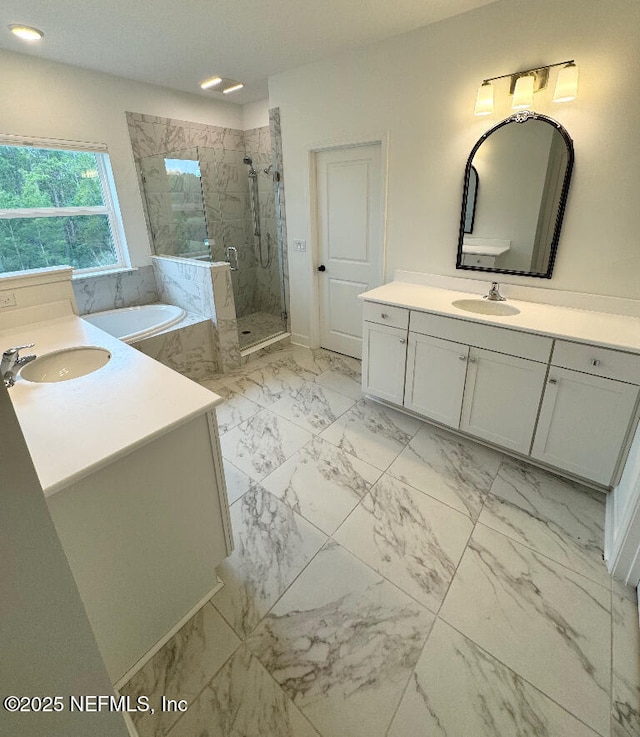 bathroom with shower with separate bathtub and vanity