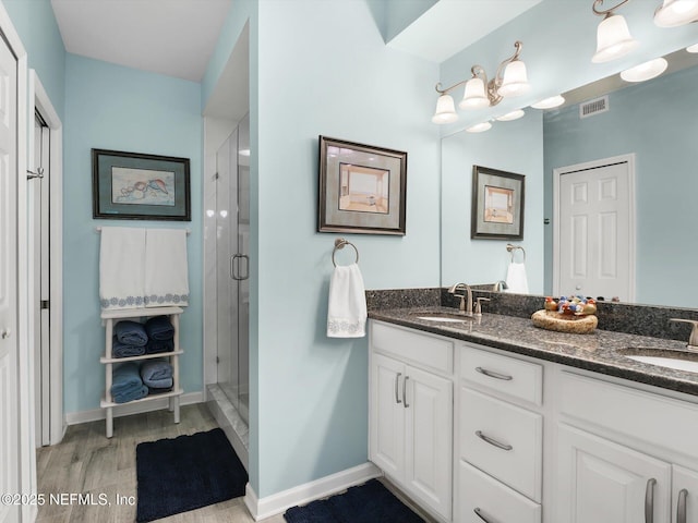 4306 Serena Cir, Saint Augustine, FL 32084 - bathroom featuring a shower stall, double vanity, visible vents, and a sink